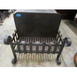A wrought iron fire grate, 16" h x 18"w