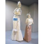 Two Lladro lady figures to include one of a lady holding a dog, 14 1/2"high