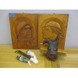 A mixed lot to include Austrian pipes, carved plaques, and a carved wall hanging brush holder in the