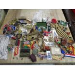 A mixed military lot to include various cloth badges, medal ribbons, a pair of leather cased