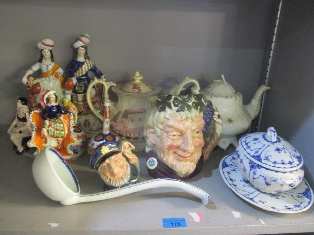 A mixed lot to include Staffordshire flatback figures, Wedgwood ladle, Doulton character jugs and