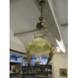 A Victorian brass framed ceiling hanging gas light with a green shade