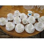 A set of twelve Royal Albert Memory Lane pattern coffee cups, saucers, sugar bowl and cream jug