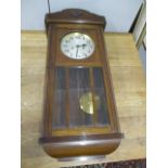 An early 20th century mahogany finished Vienna style wall clock