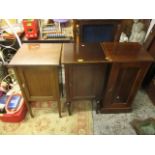 Three Edwardian mahogany bedside cabinets, each with a panelled door