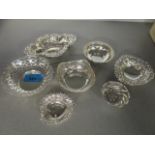 A group of various silver pin dishes, some with pierced decoration, others with repousse decoration,