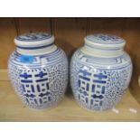 A pair of oriental blue and white ginger jars, 10" h