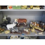 A selection of models to include Border Fine Arts and Danbury Mint, a Royal Doulton model of a