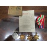 A group of four WWII campaign medals with medal leaflet and original issue card box named to T H