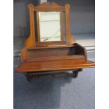 A late Victorian/early Edwardian walnut candle box with bevelled plate and hinged fall flap below