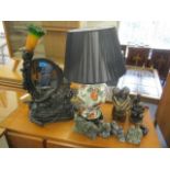 A mixed lot to include a table lamp with inset mirror decorated with a nude woman, Eskimo