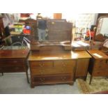 An Edwardian matched set of inlaid mahogany bedroom suite comprising a dressing table, a chest of