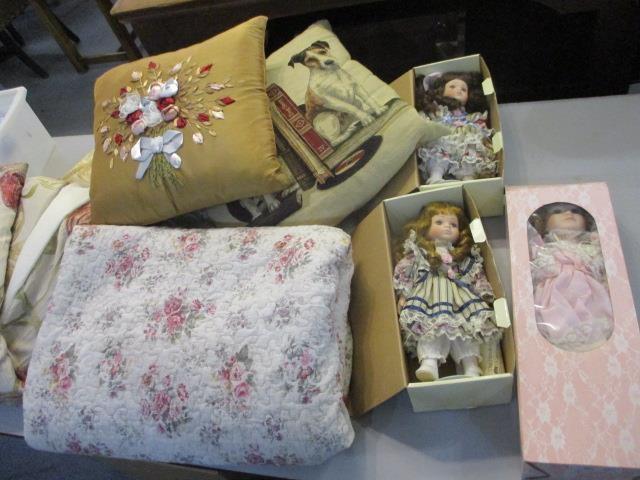 A mixed lot of cushions, a bed throw, curtains and porcelain dolls