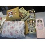 A mixed lot of cushions, a bed throw, curtains and porcelain dolls