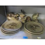 A collection of Poole stoneware pottery to include collectors plates, an otter and others