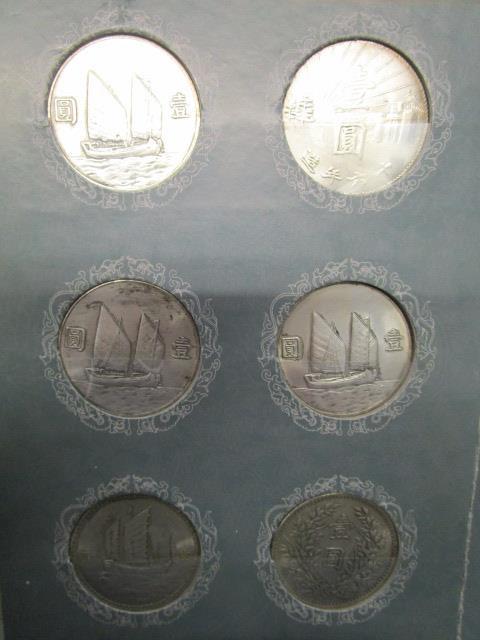 A collection of Chinese dollar coins mounted in two card displays - Image 6 of 8