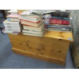 A modern pine ottoman standing on a plinth base, 19" x 35 1/2"w