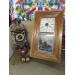 A reproduction American walnut wall clock, with printed and coloured picture pendulum aperture and a