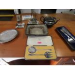 Silver plate to include a bread basket, fish servers, a pair of servers, a Match box holder/