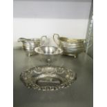 A selection of silver to include Goldsmiths and Silversmiths London shaped sugar bowl and milk