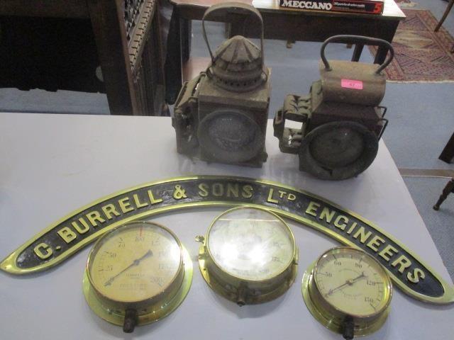 Two railway lanterns on sprung brackets, three brass pressure gauges and a brass C Burrell & Sons