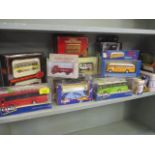 A collection of boxed diecast model buses