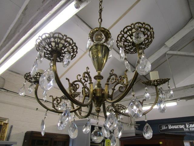 A French brass six branch ceiling hanging light with crystal drops, rewired