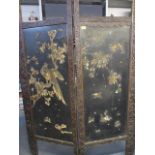 An early 20th century Chinese rosewood two fold screen with carved frame and black painted panels,
