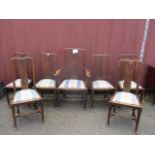 A set of seven 19th century Queen Anne style oak dining chairs