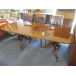 A good quality reproduction mahogany Regency style dining table with extra leaf 29"h x 83 1/2"w