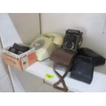 A mixed lot to include a vintage telephone, a Skymatic camera, a View Master and two other cameras