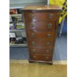 A small bank of six mahogany drawers