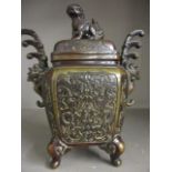 An early 20th century bronze oriental pot with lid