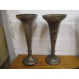 A pair of early 20th century silver trumpet shaped vases, on a splayed foot