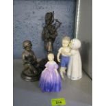 A Bing and Grondahl Copenhagen porcelain figure group of a girl kissing a reluctant boy, a Royal