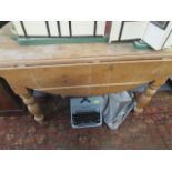 A pine fall flap table standing on turned, shaped legs, 30" h x 51 1/2"w