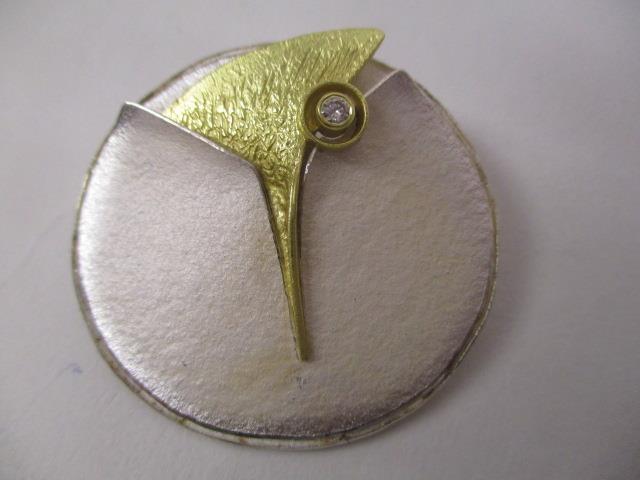 An 18ct yellow gold, silver and enamelled modernist style pendant/brooch set with a 0.06ct