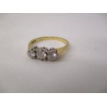 An 18ct gold ring set with three diamonds, approximately 0.7ct total, size Q, 2.8g