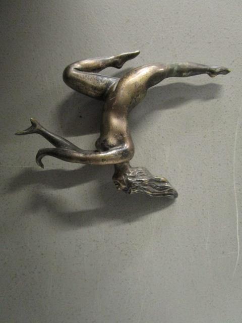 An early 20th century silver plated figurine of a nude woman leaping 3 5/8"h