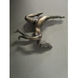 An early 20th century silver plated figurine of a nude woman leaping 3 5/8"h