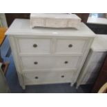 A modern French painted chest of two short and two long drawers on short turned legs 39 1/2"h x 35