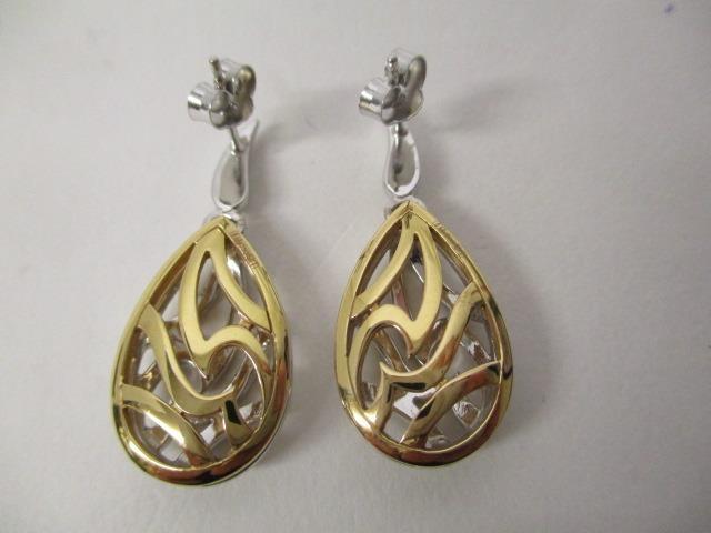 A pair of 18ct yellow and white gold earrings of drop design, with pierced decoration, set with - Image 5 of 5