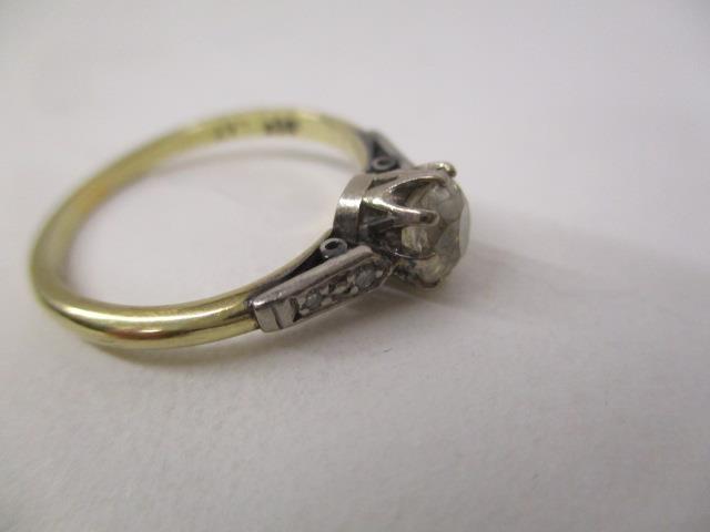 A gold and platinum coloured ring set with an oval diamond, approximately 0.65ct with four - Image 5 of 5