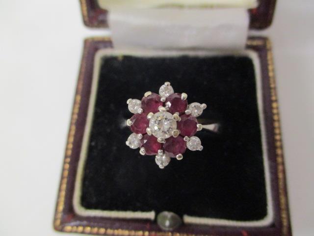 An 18ct white gold diamond and ruby ring in claw setting, size P, 5g