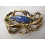 A gold coloured metal organic style brooch, possibly American, set with a lozenge shaped opal