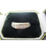 A platinum diamond set full eternity ring with twenty channel set with princess cut diamonds, each