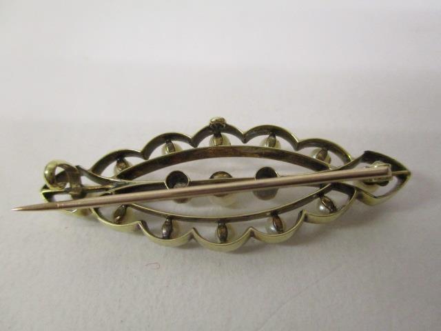 A gold and white coloured metal brooch of oval lobed form, set with thirteen pearls and two diamonds - Image 3 of 3