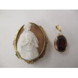 A 9ct gold pendant set with a diamond and a brown coloured stone, along with a cameo brooch with a