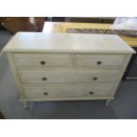 A modern French painted chest of two short and two long drawers on short turned legs 34"h x 45"w