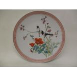 A mid/late 20th century Chinese dish decorated with birds in a flowering branch and flowers below,